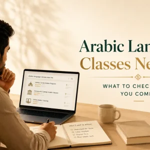 Adult learner comparing Arabic language classes near me on a laptop while planning goals for Quranic Arabic and Islamic studies