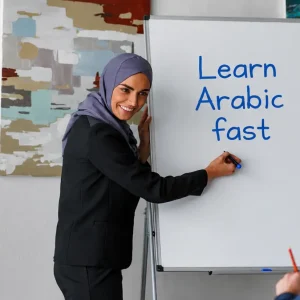 Woman in hijab writing "How to Learn Arabic fast" on a whiteboard during a group lesson